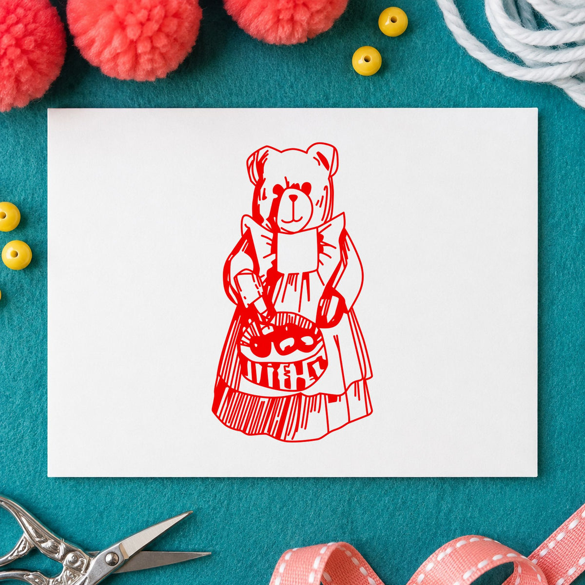 Country Bear with Produce Basket Rubber Stamp impression in red ink on white paper in a styled craft setting.