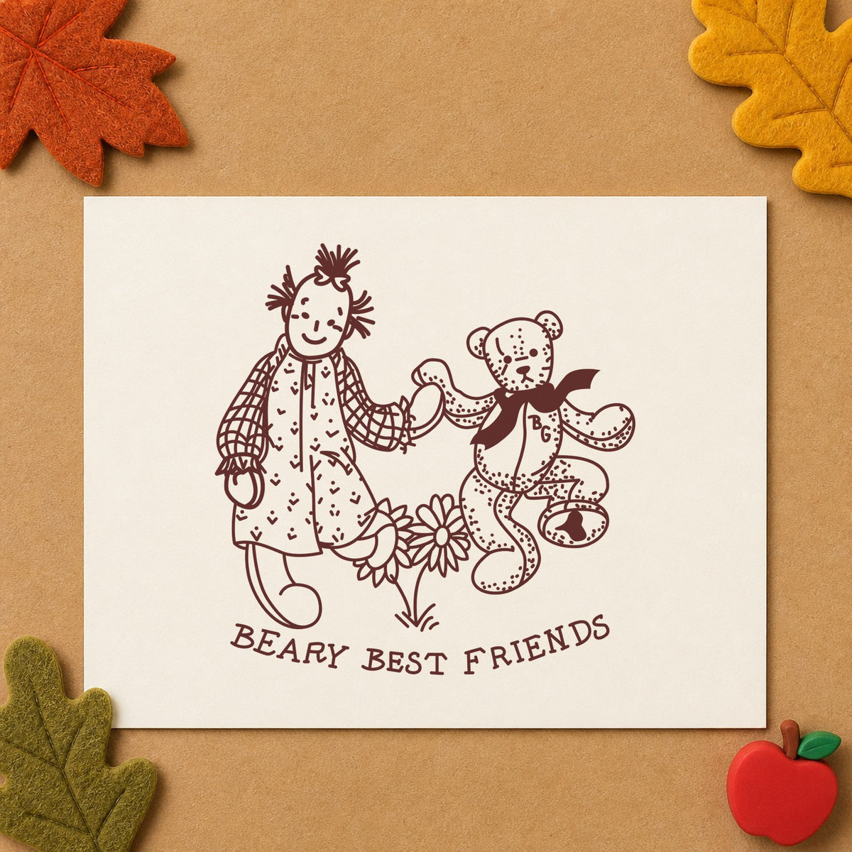 Beary Best Friends Bear and Doll Rubber Stamp impression in brown ink on white paper in a styled craft setting.