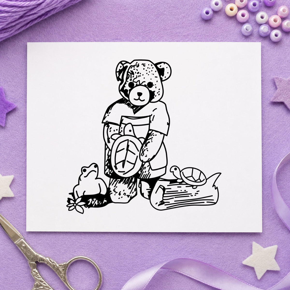 Bear with Turtles Rubber Stamp impression in black ink on white paper in a styled craft setting.