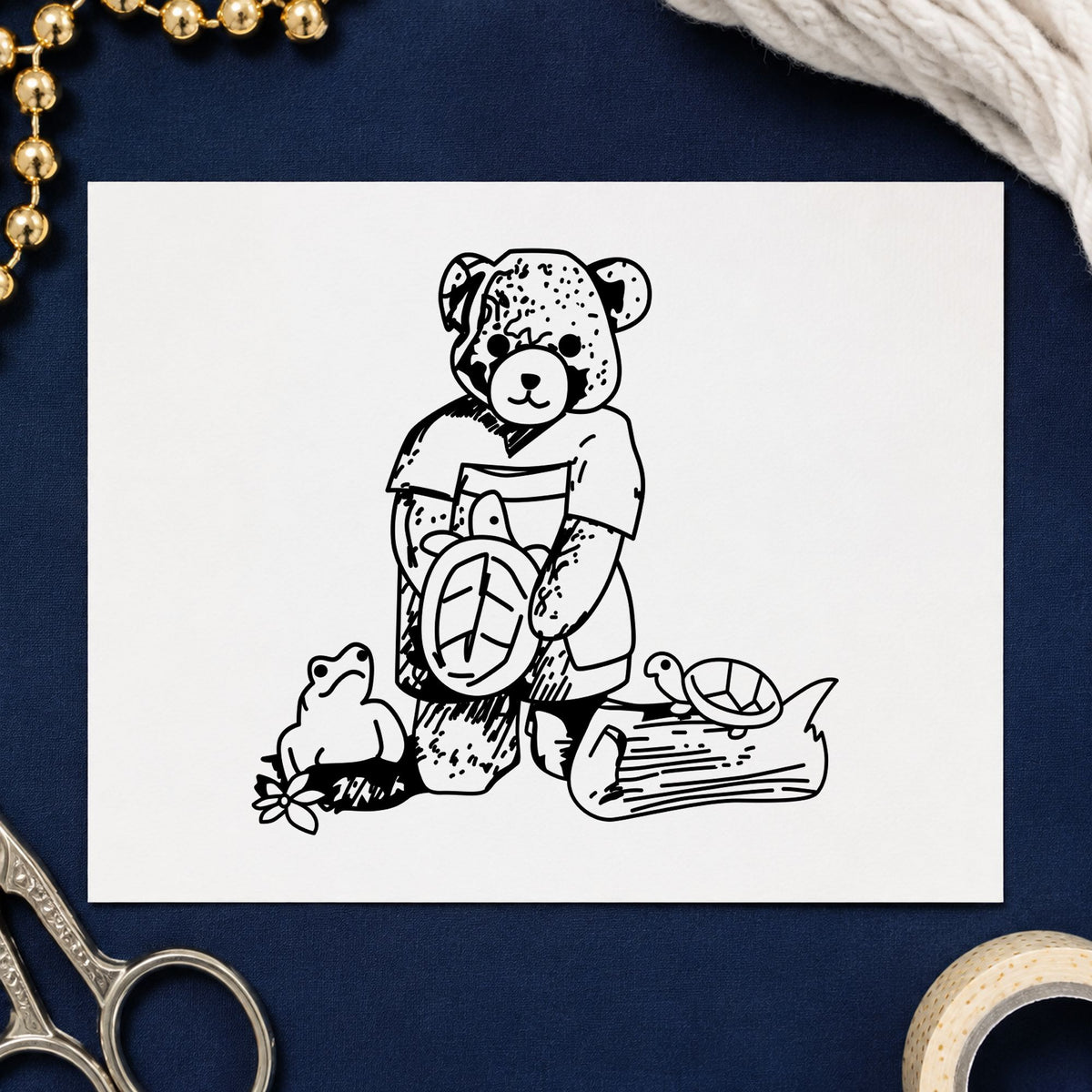 Black impression from a turtle rubber stamp, featuring the bear with turtles design on white paper.