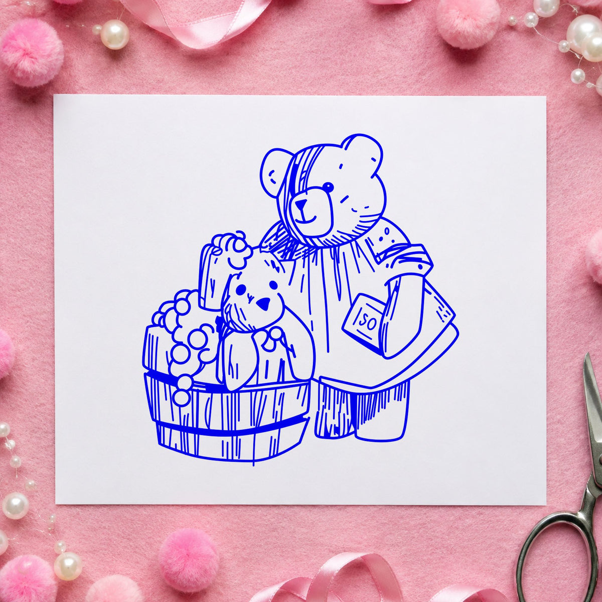 Bear Washing Teddy in Barrel Rubber Stamp impression in blue ink on white paper in a styled craft setting.