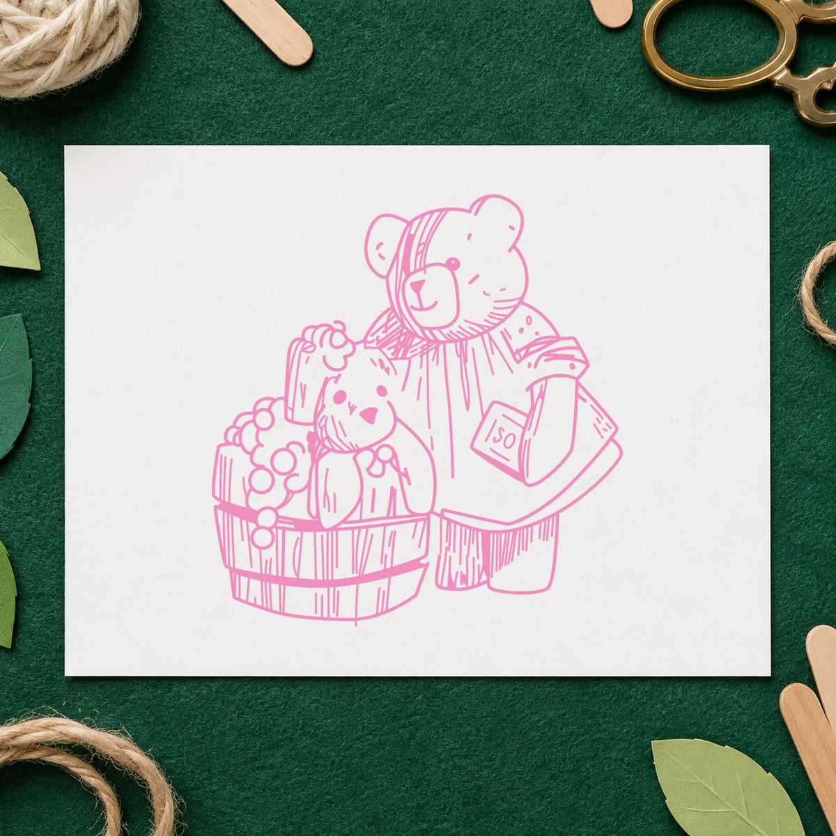 Bear Washing Teddy in Barrel Rubber Stamp impression in pink ink on white paper in a styled craft setting.