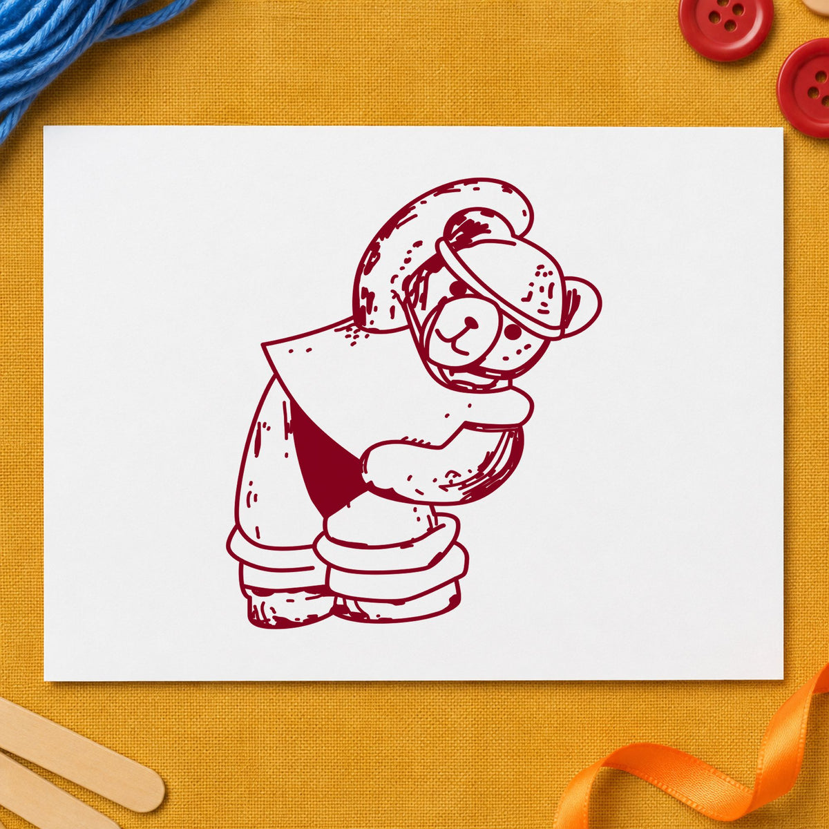 Workout Bear in Headband Rubber Stamp impression in burgundy ink on white paper in a styled craft setting.