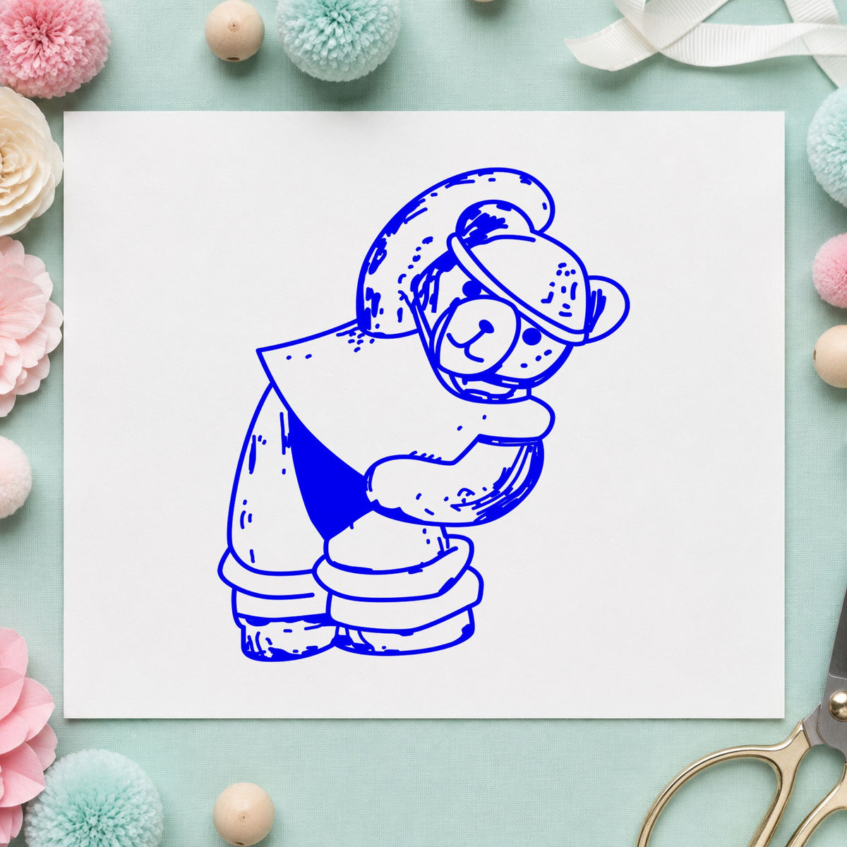 Workout Bear in Headband Rubber Stamp impression in blue ink on white paper in a styled craft setting.