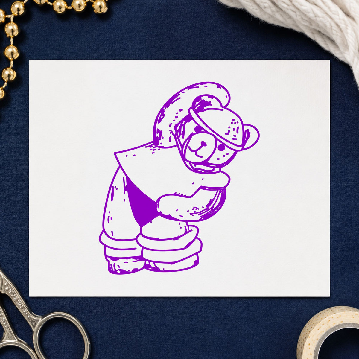 Workout Bear in Headband Rubber Stamp impression in purple ink on white paper in a styled craft setting.