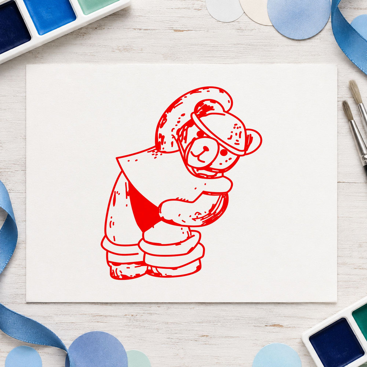 Workout Bear in Headband Rubber Stamp impression in red ink on white paper in a styled craft setting.