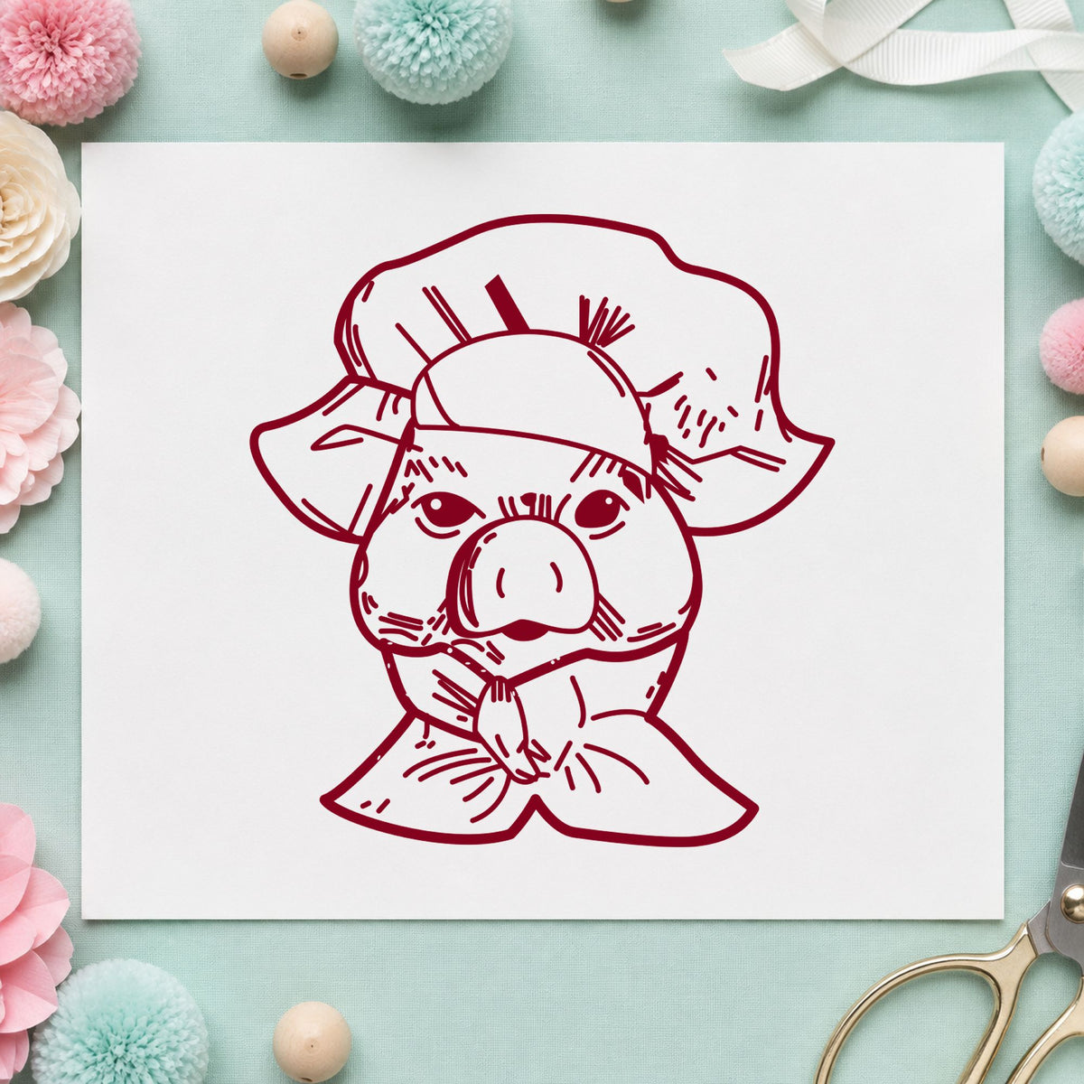 Chef Pig Portrait Rubber Stamp impression in burgundy ink on white paper in a styled craft setting.