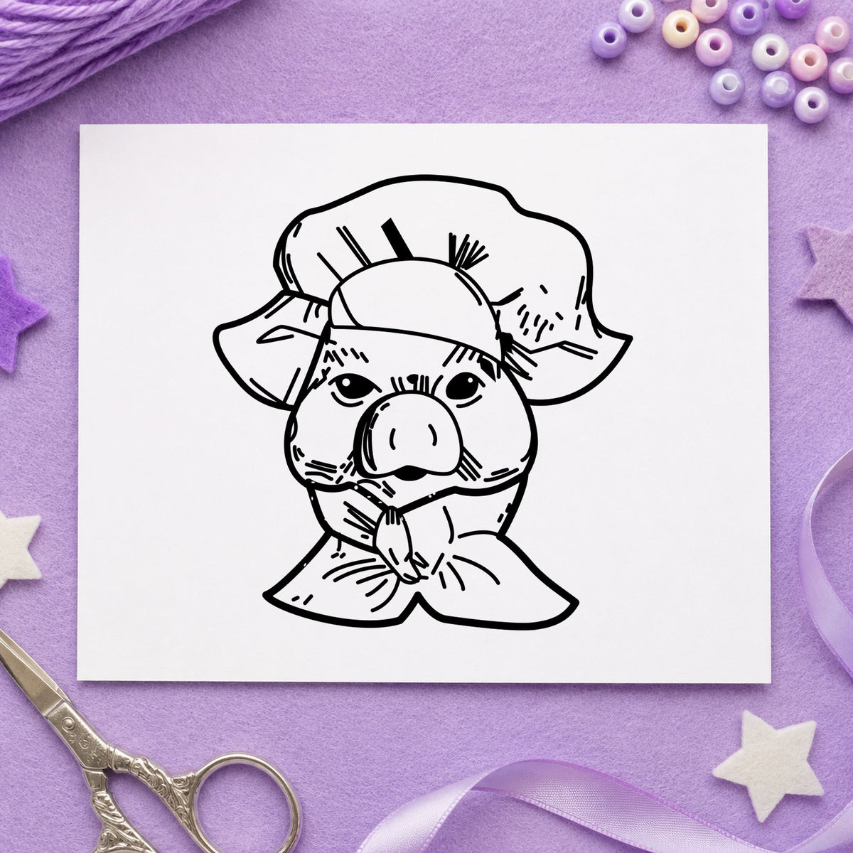 Black impression from a chef rubber stamp, featuring the chef pig portrait design on white paper.
