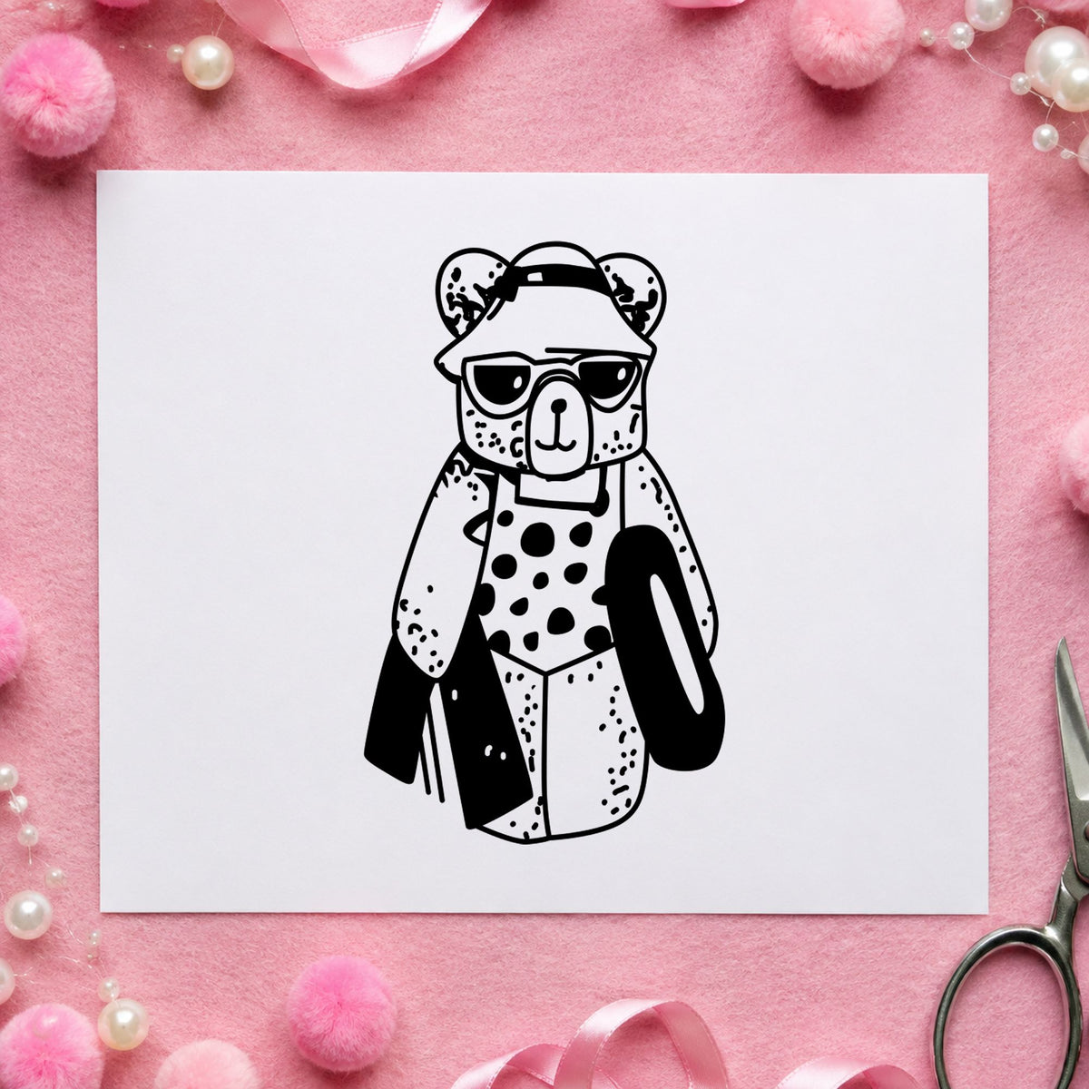 Bear with Inner Tube Rubber Stamp impression in black ink on white paper in a styled craft setting.