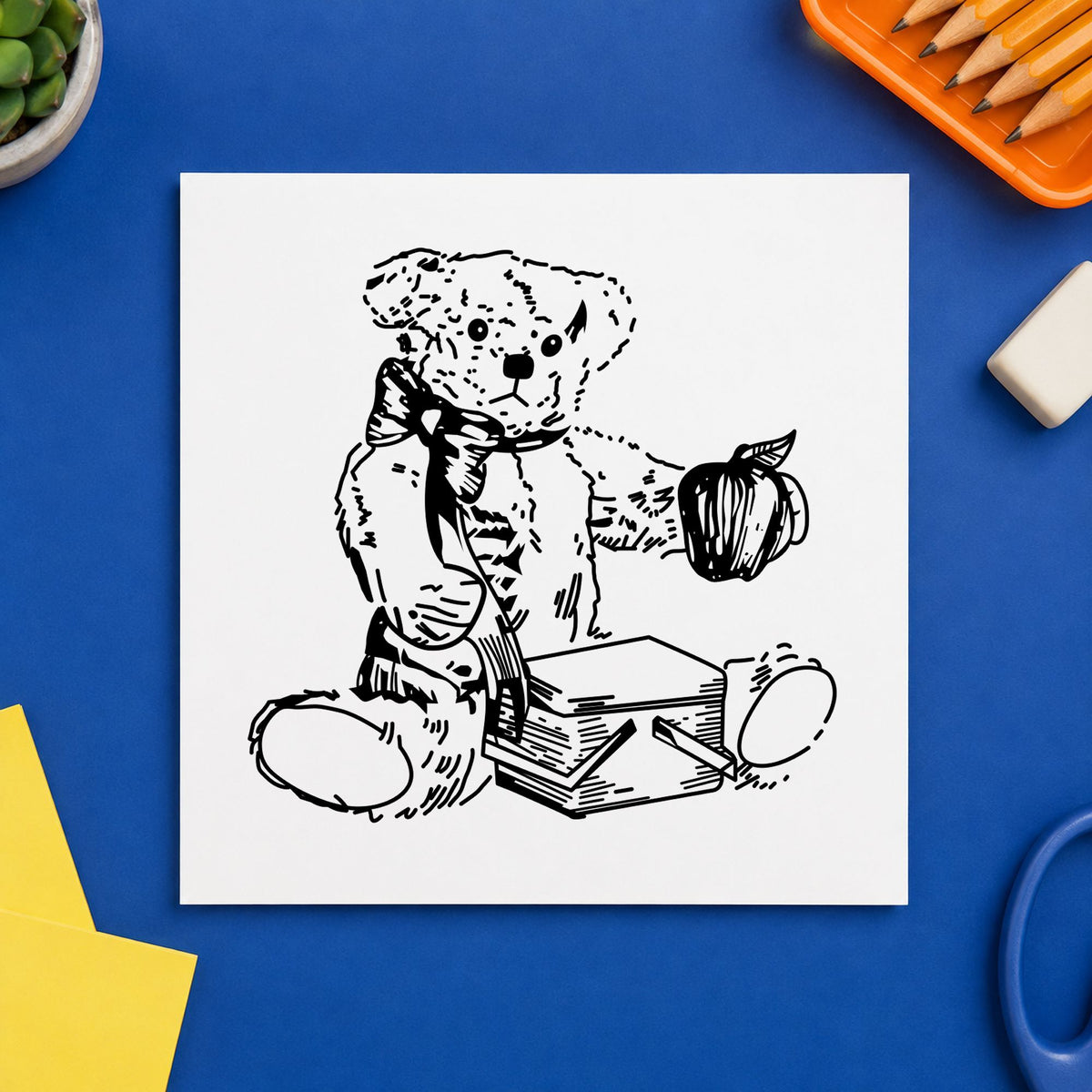 Black impression from a picnic basket stamp, featuring the bear with picnic basket and apple design on white paper.