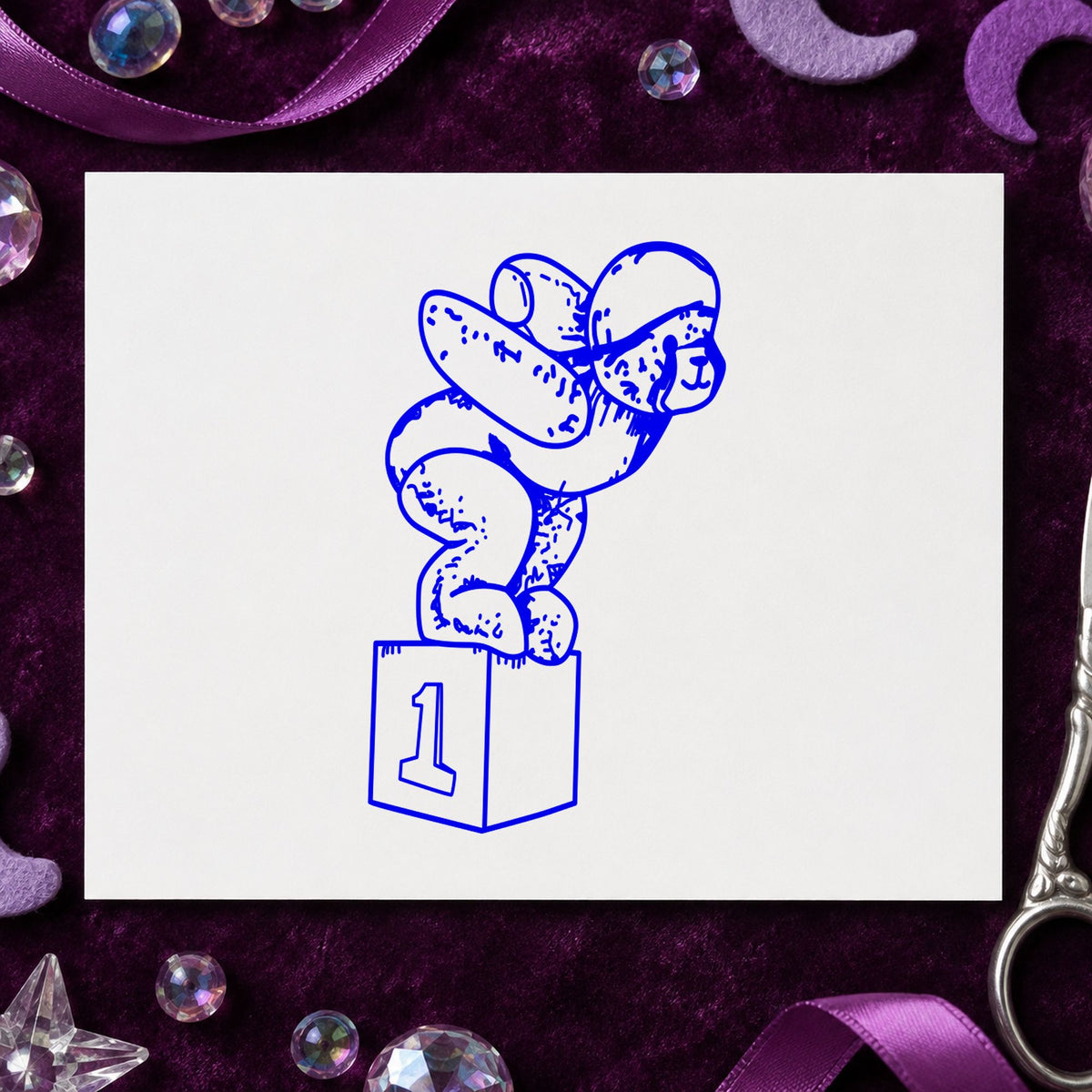 Blue teddy bear sports stamp impression featuring the diving bear on starting block design on white paper.