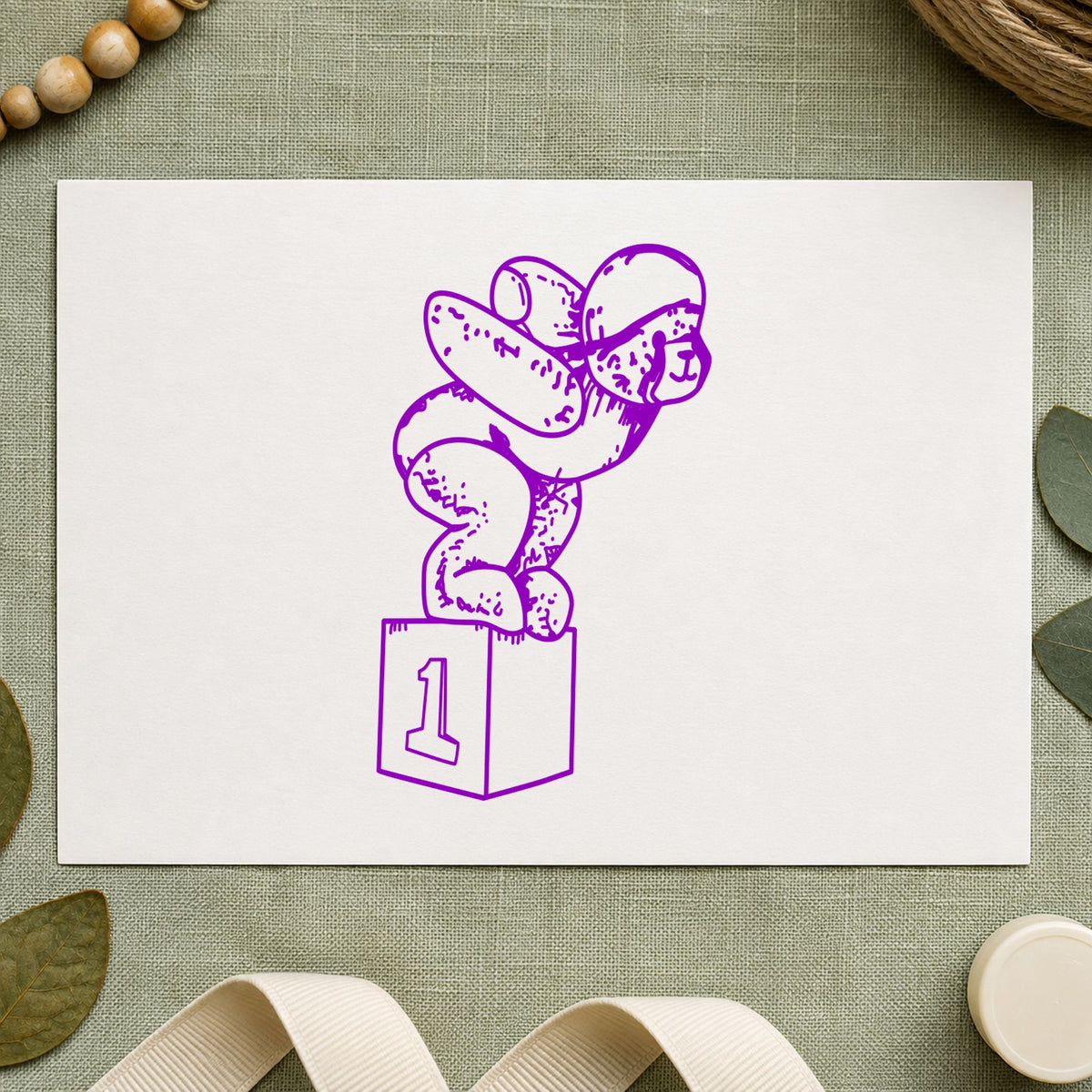 Diving Bear on Starting Block Rubber Stamp impression in purple ink on white paper in a styled craft setting.