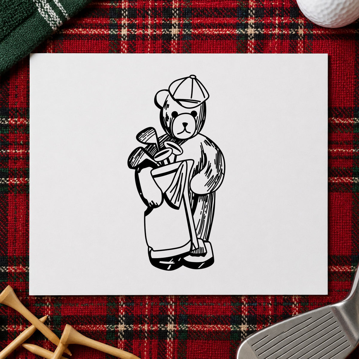 Black impression from a golf rubber stamp, featuring the golf bear with clubs design on white paper.