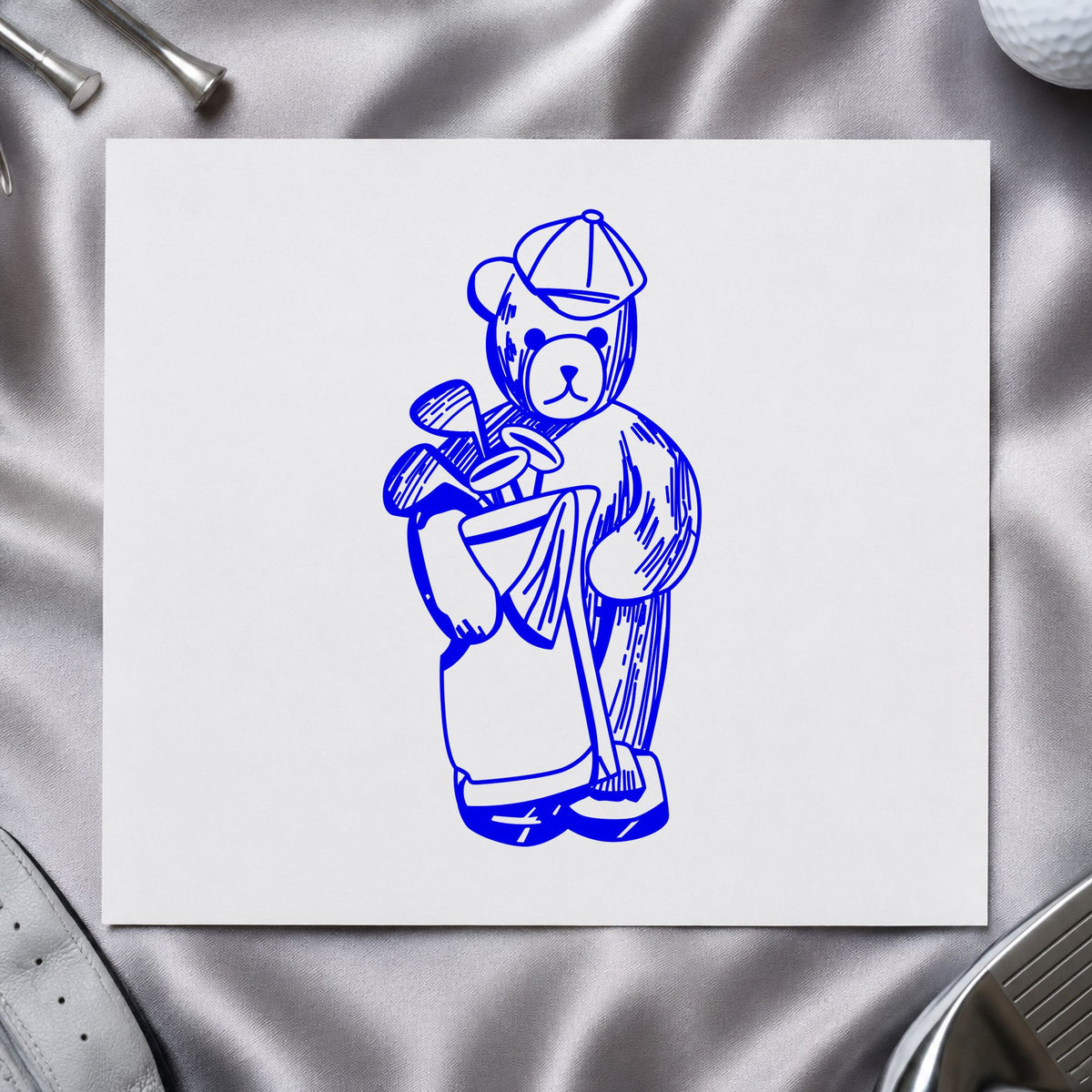 Golf Bear with Clubs Rubber Stamp impression in blue ink on white paper in a styled craft setting.
