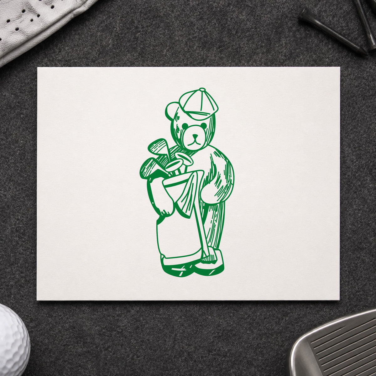 Golf Bear with Clubs Rubber Stamp impression in green ink on white paper in a styled craft setting.