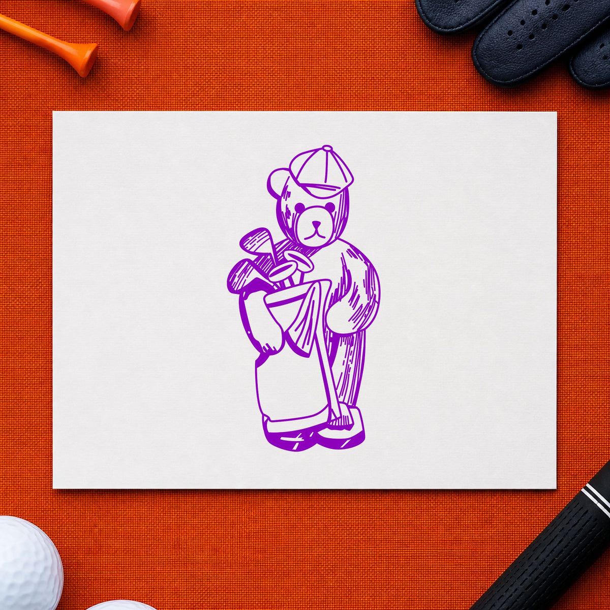 Golf Bear with Clubs Rubber Stamp impression in purple ink on white paper in a styled craft setting.