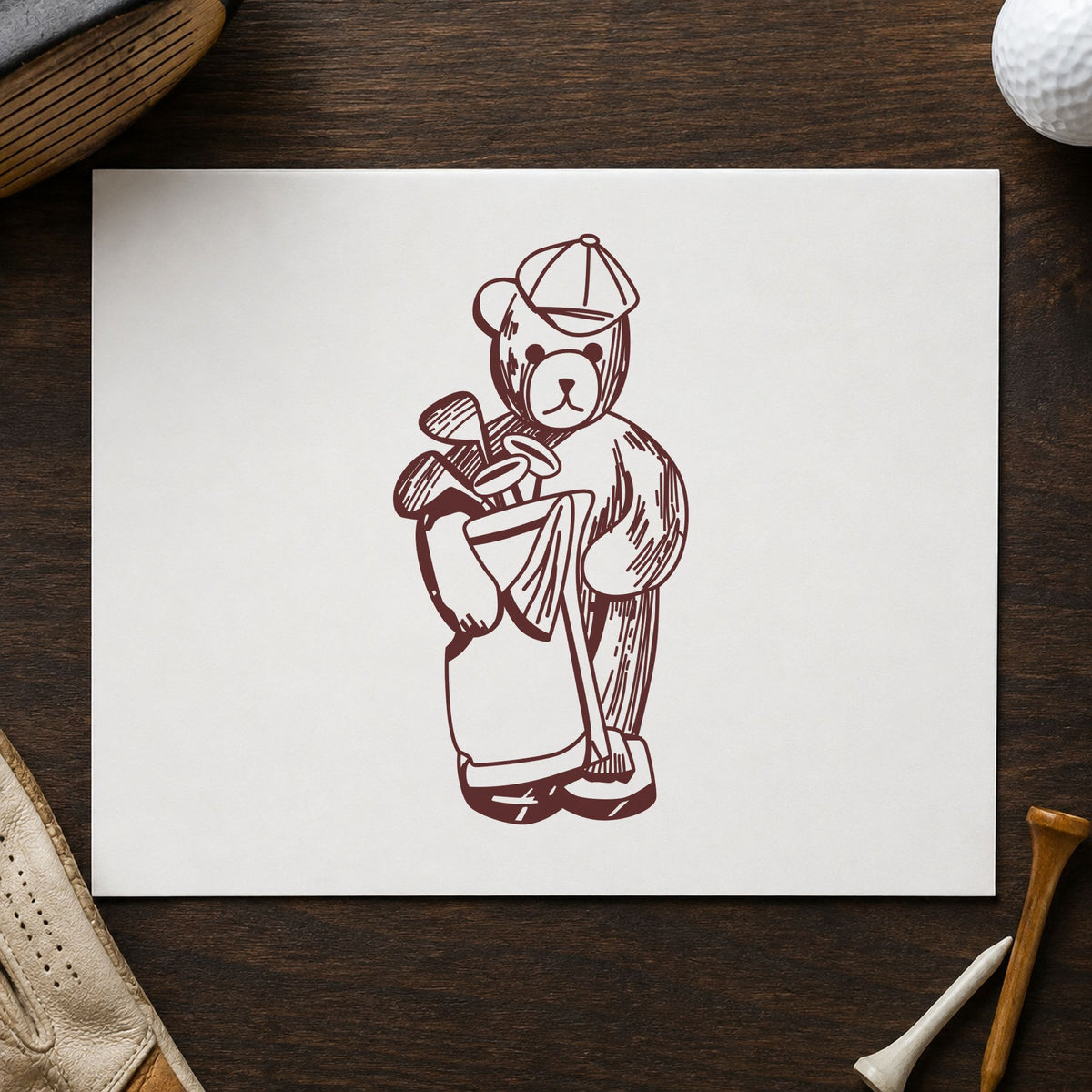 Golf Bear with Clubs Rubber Stamp impression in brown ink on white paper in a styled craft setting.