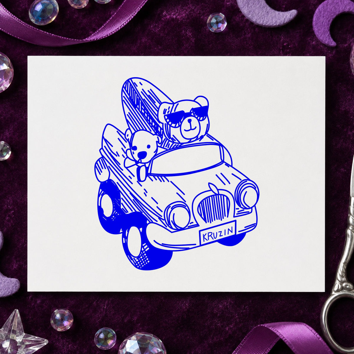 Blue summer travel stamp impression featuring the surfboard bear in convertible design on white paper.