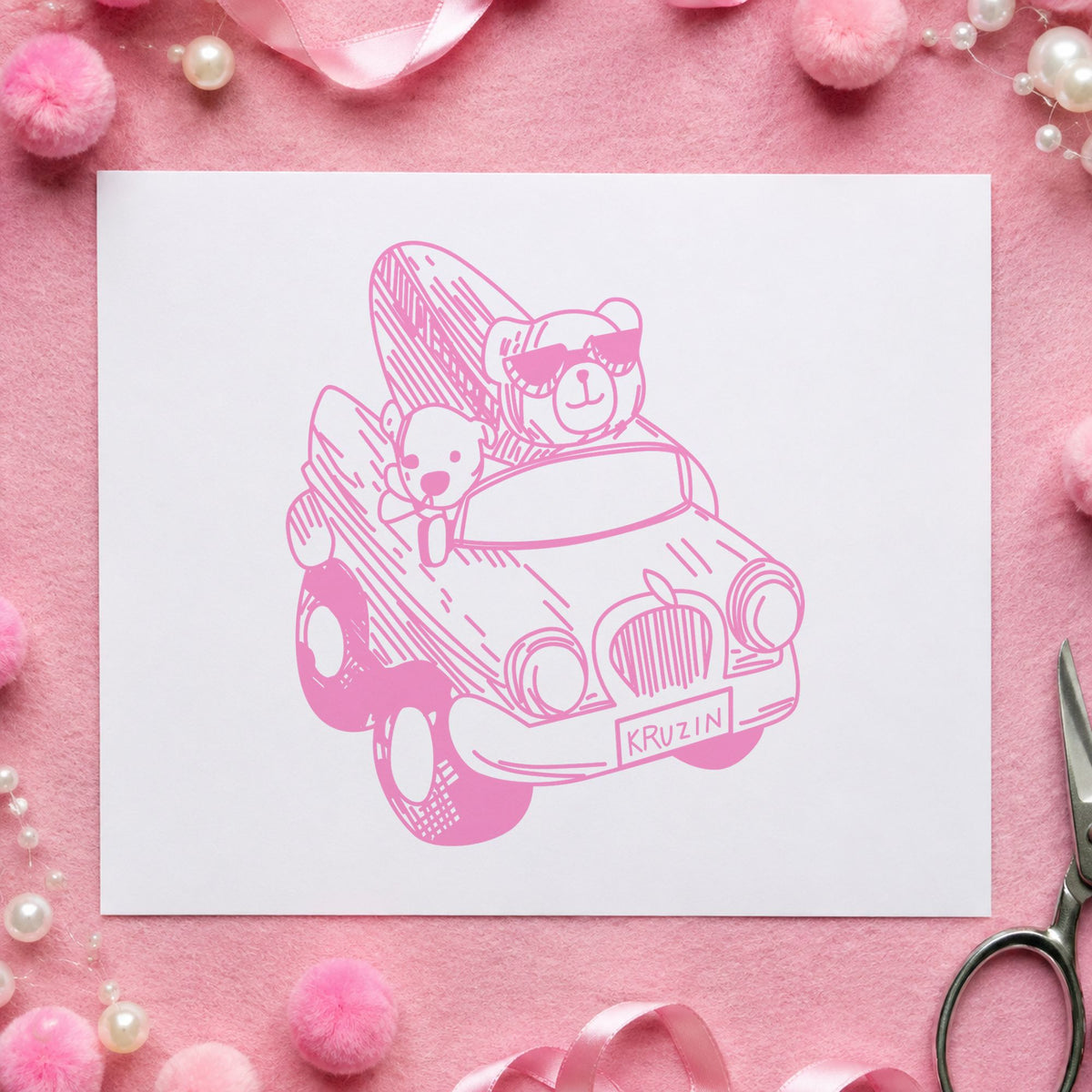 Surfboard Bear in Convertible Rubber Stamp impression in pink ink on white paper in a styled craft setting.