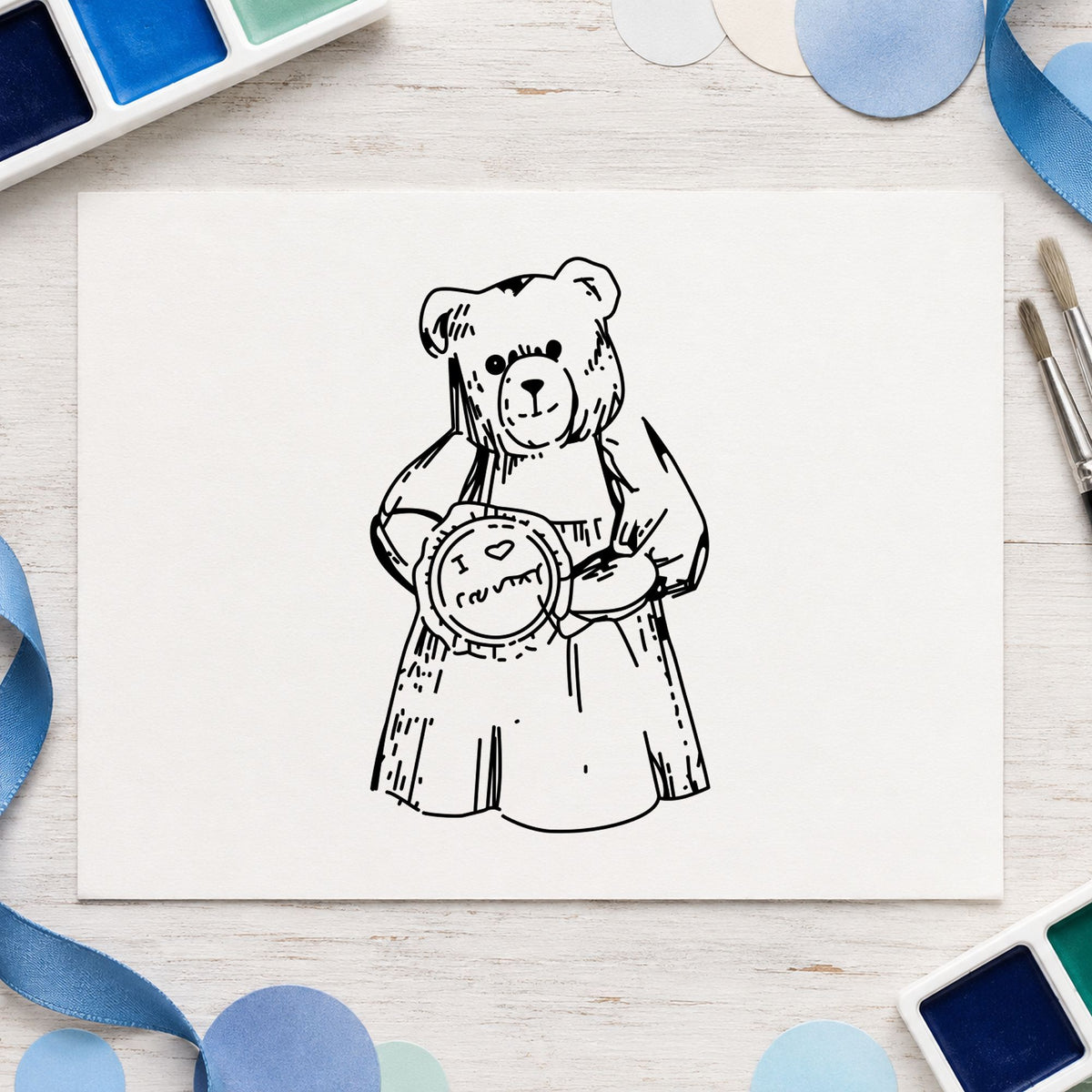Black impression from a country bear stamp, featuring the i love country bear with pie design on white paper.