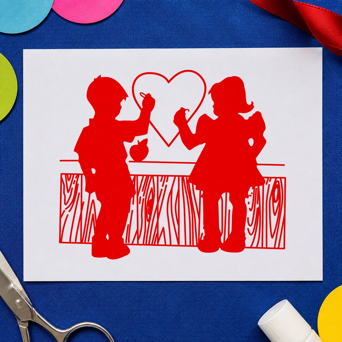 Boy and Girl Drawing a Heart Rubber Stamp impression in red ink on white paper in a styled craft setting.