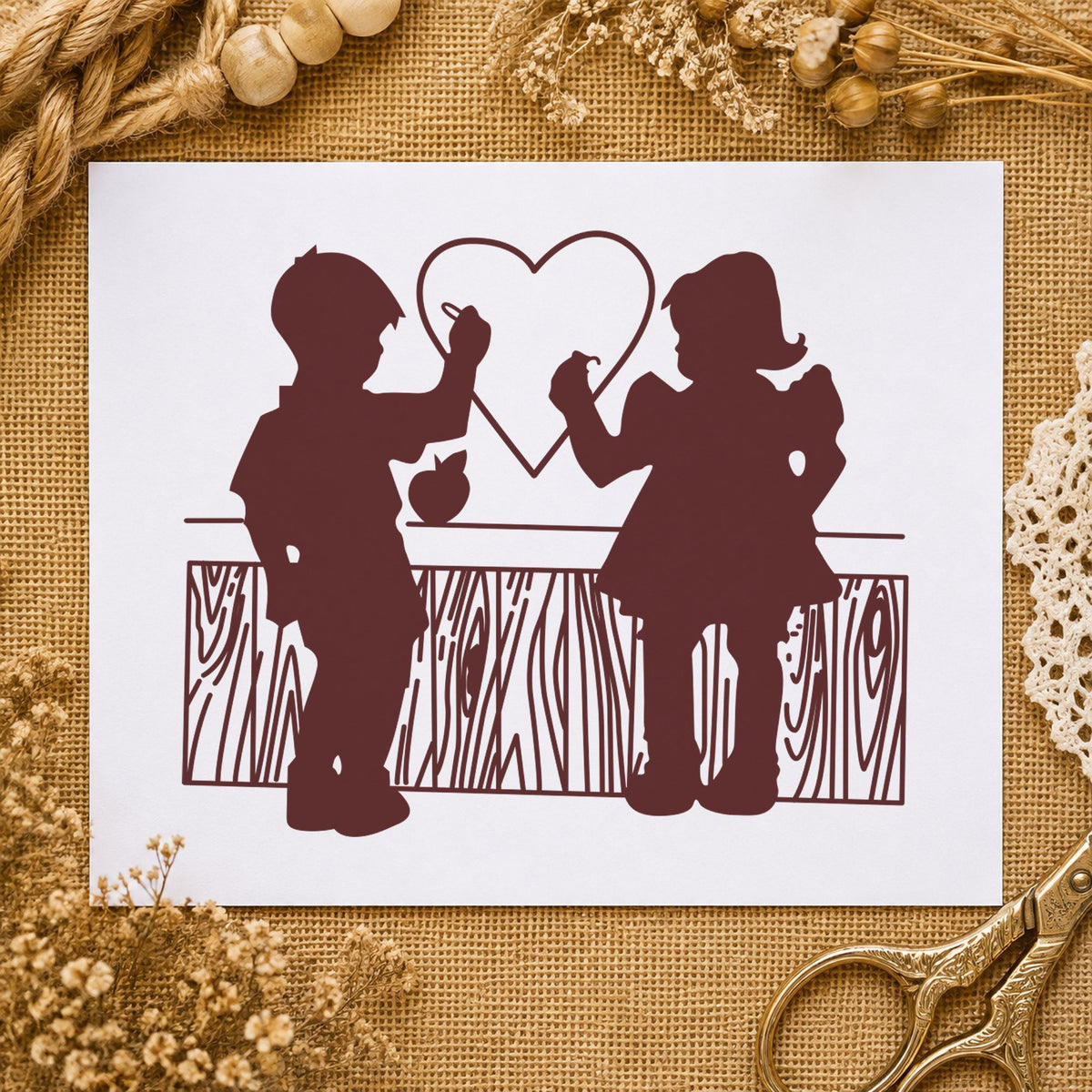 Boy and Girl Drawing a Heart Rubber Stamp impression in brown ink on white paper in a styled craft setting.
