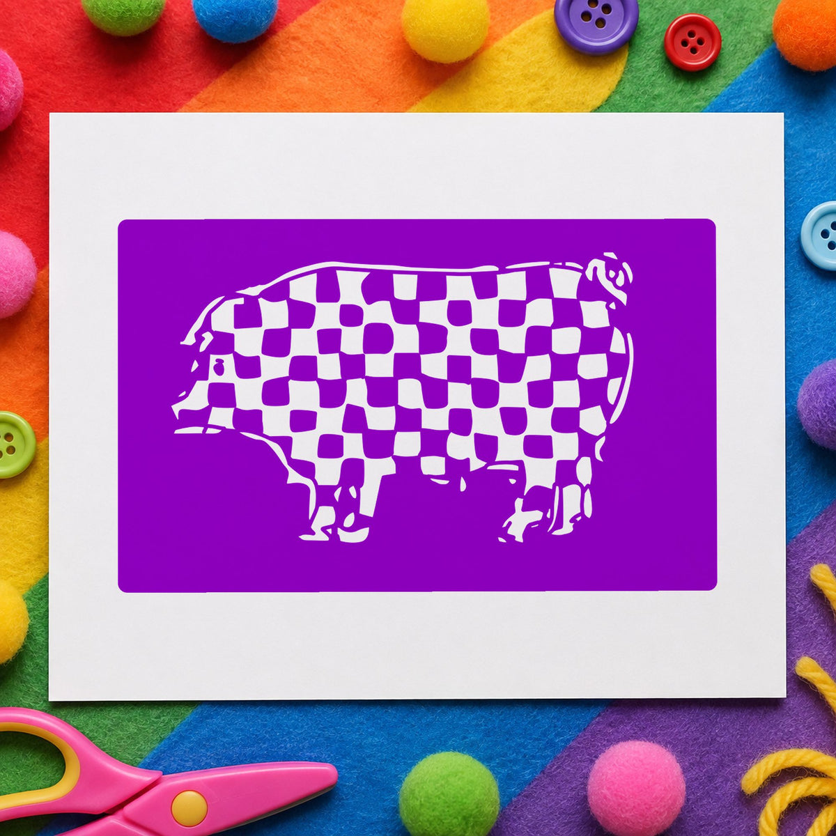 Checkered Pig Block Rubber Stamp impression in purple ink on white paper in a styled craft setting.