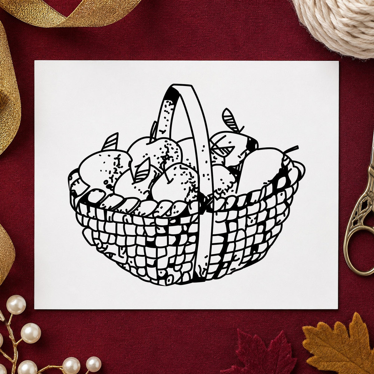Black impression from a apple rubber stamp, featuring the round apple basket design on white paper.