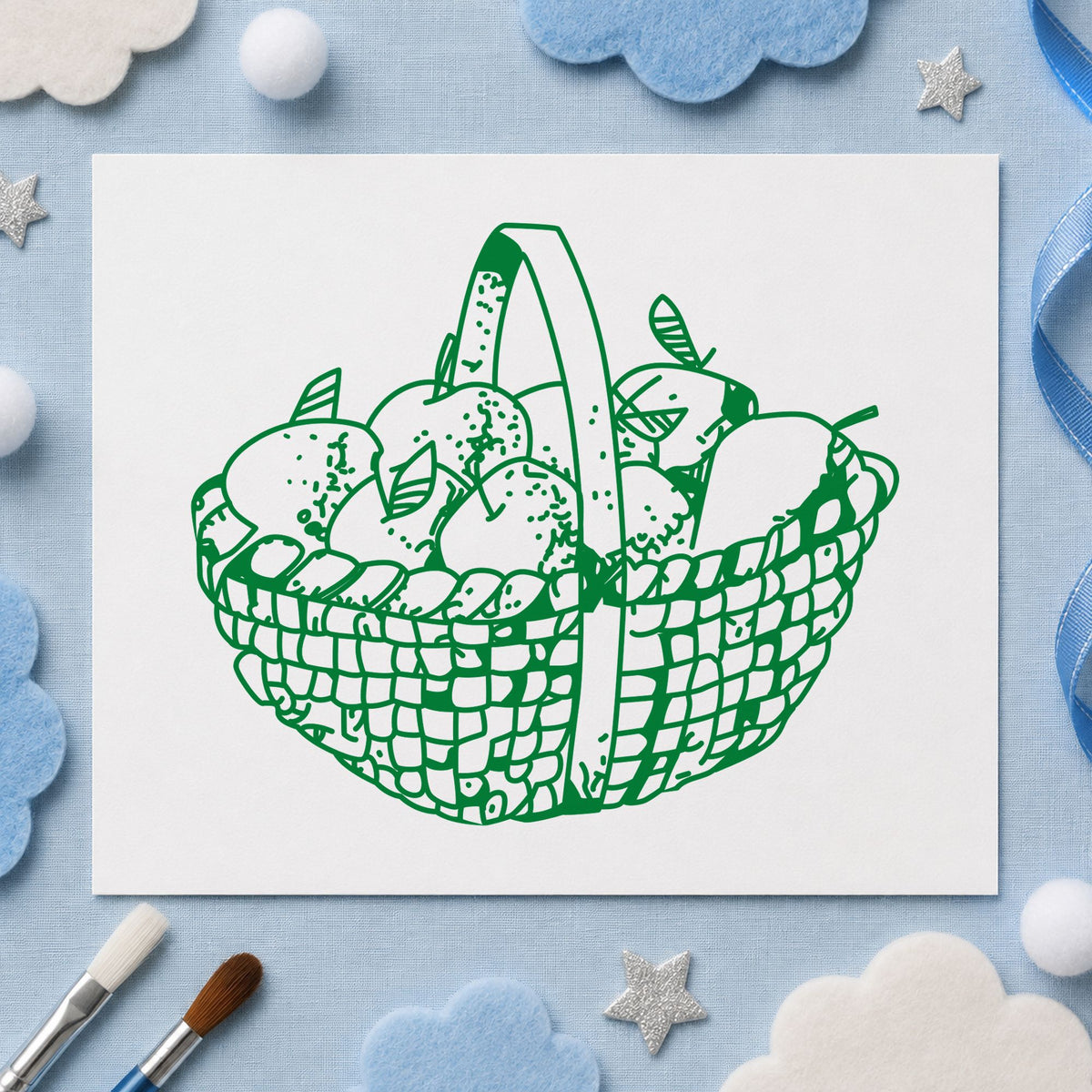 Round Apple Basket Rubber Stamp impression in green ink on white paper in a styled craft setting.