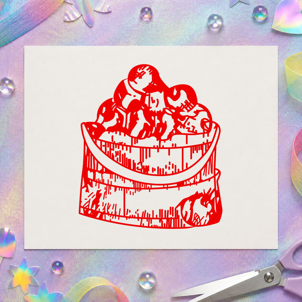 Wooden Bucket of Apples Rubber Stamp impression in red ink on white paper in a styled craft setting.