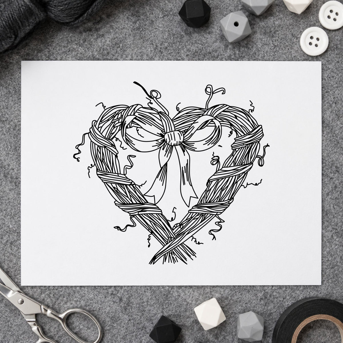 Heart Wreath with Bow Rubber Stamp impression in black ink on white paper in a styled craft setting.