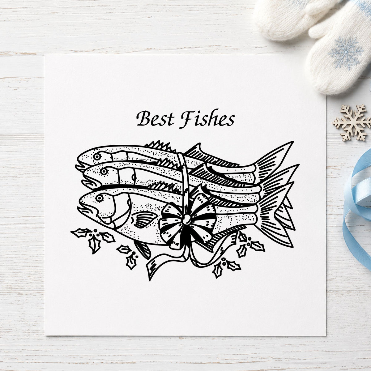 Best Fishes with Poinsettias Rubber Stamp impression in black ink on white paper in a styled craft setting.