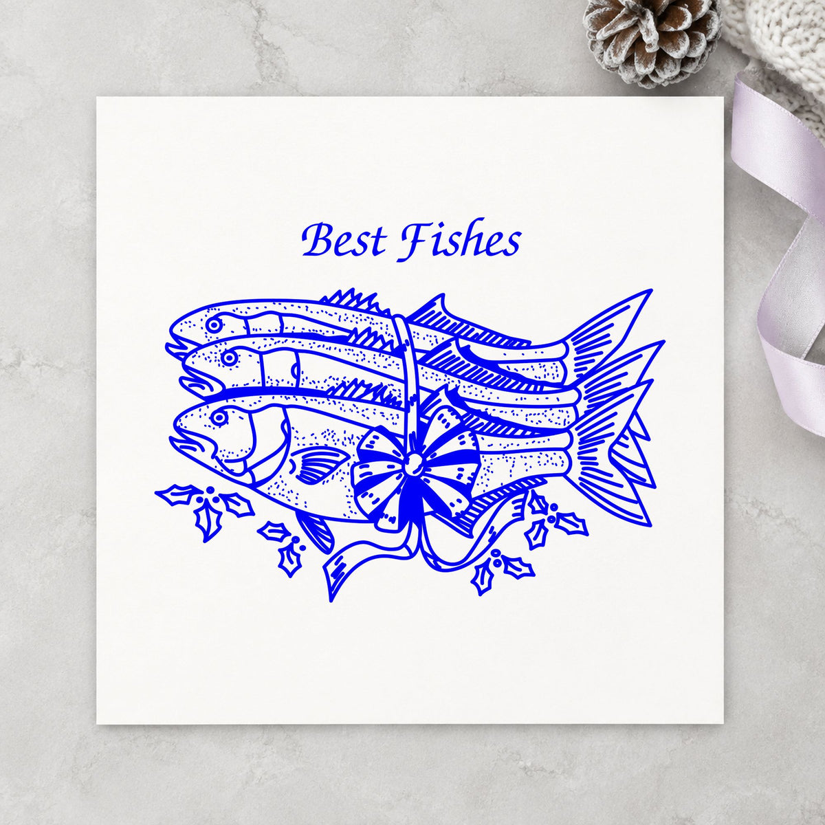 Blue christmas pun stamp impression featuring the best fishes with poinsettias design on white paper.