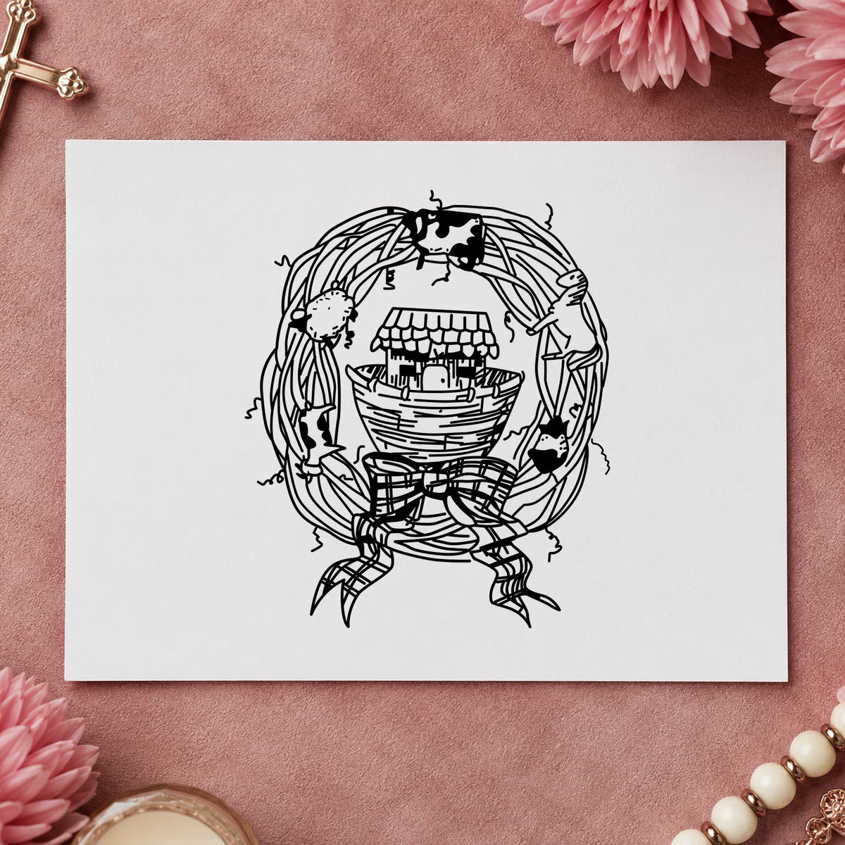 Ark in Wreath Rubber Stamp impression in black ink on white paper in a styled craft setting.