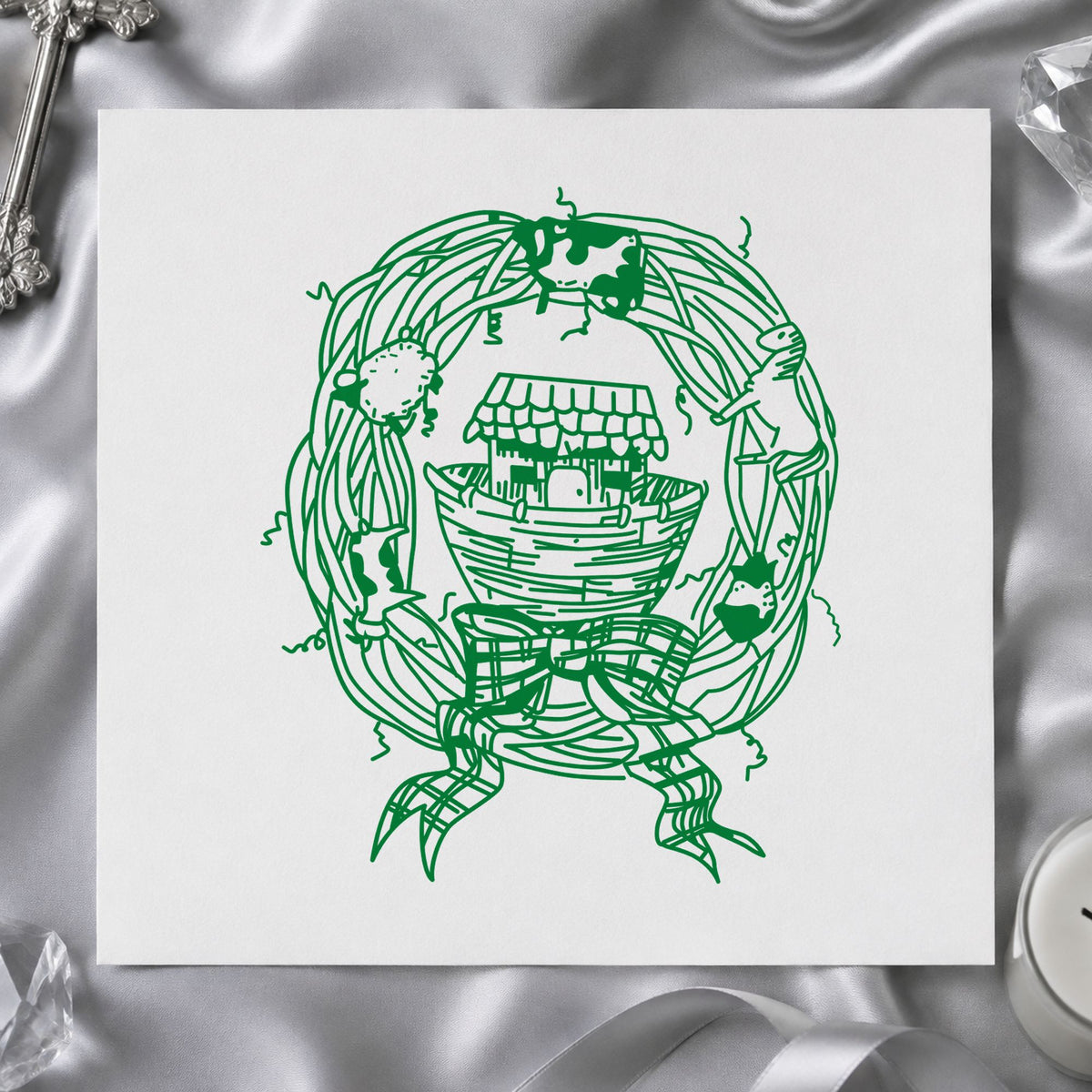 Ark in Wreath Rubber Stamp impression in green ink on white paper in a styled craft setting.