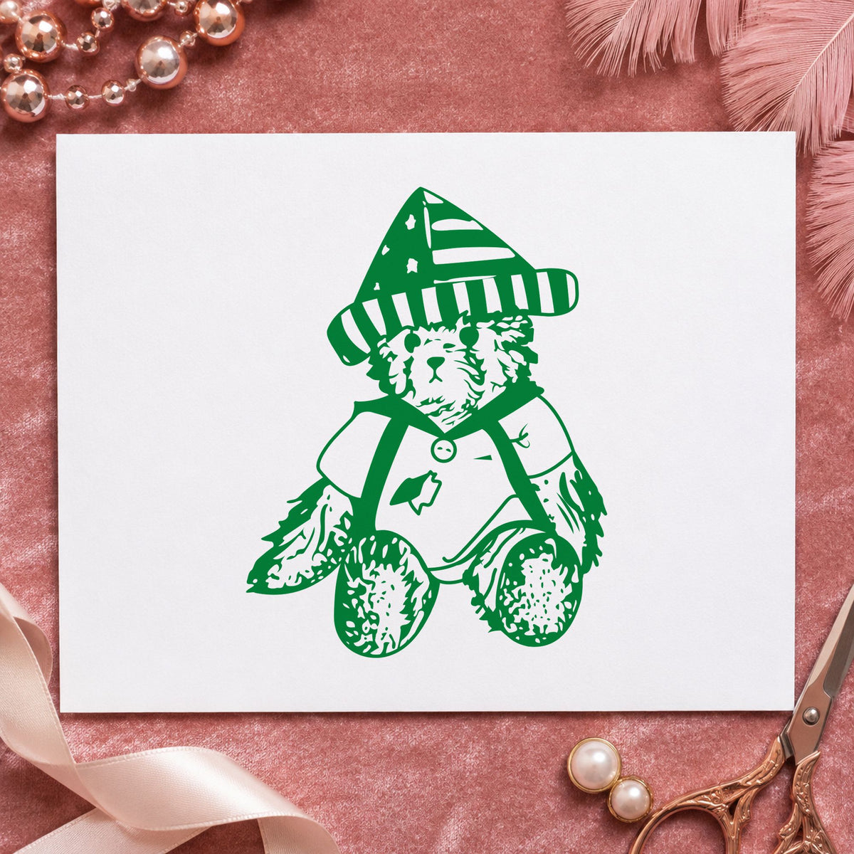 Bear in Stars and Stripes Hat Rubber Stamp impression in green ink on white paper in a styled craft setting.