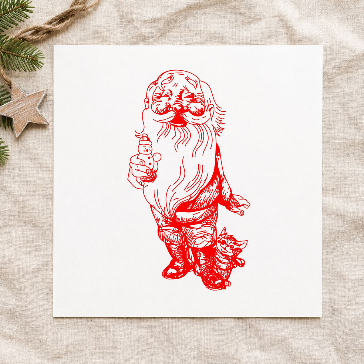 Santa with Kitten and Snowman Rubber Stamp impression in red ink on white paper in a styled craft setting.