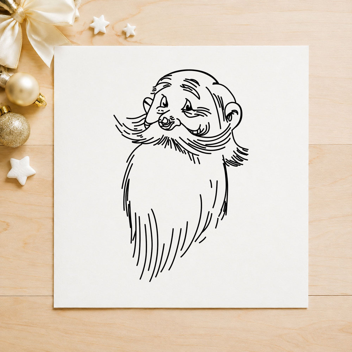 Black impression from a santa rubber stamp, featuring the santa claus face design on white paper.