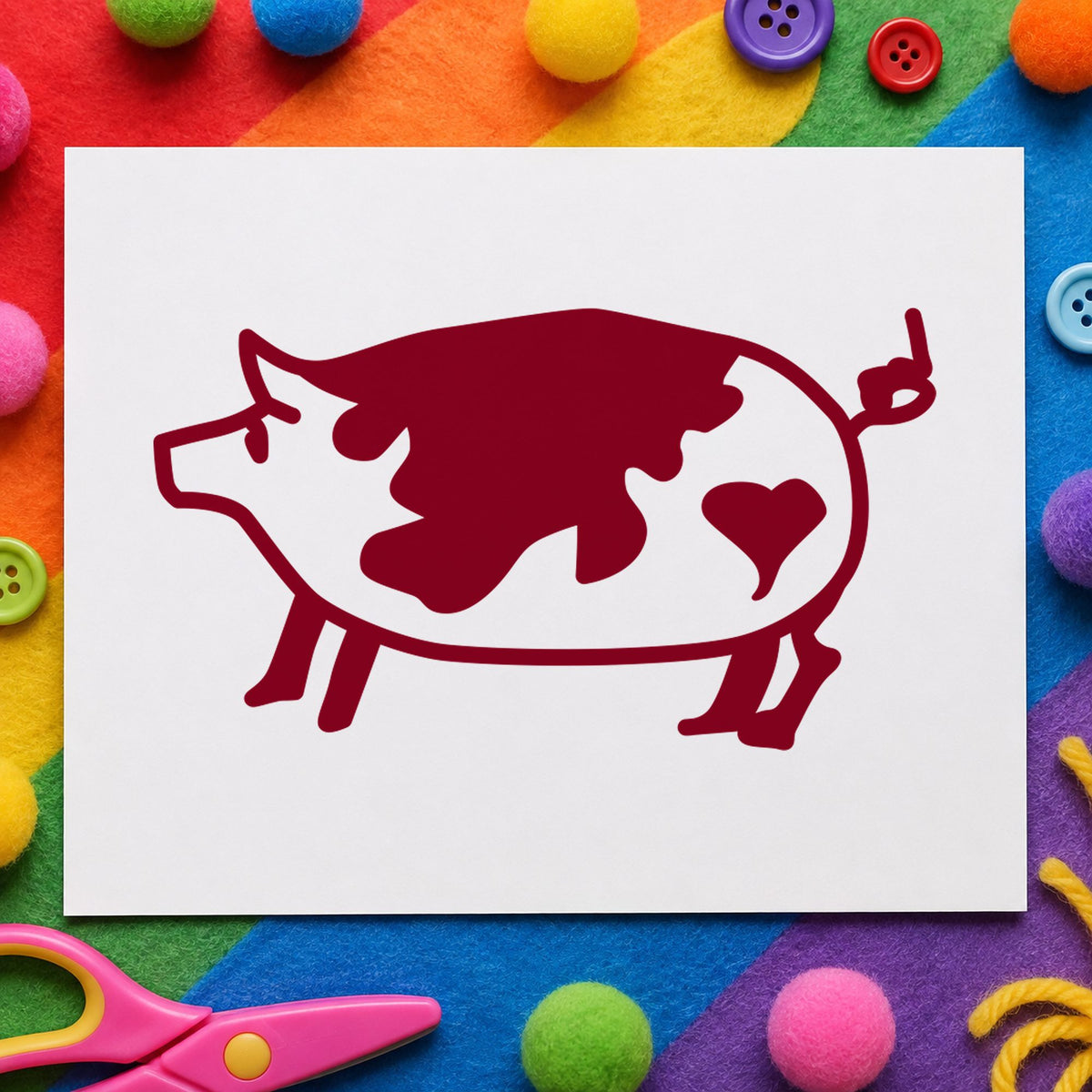 Spotted Pig with Heart Rubber Stamp impression in burgundy ink on white paper in a styled craft setting.