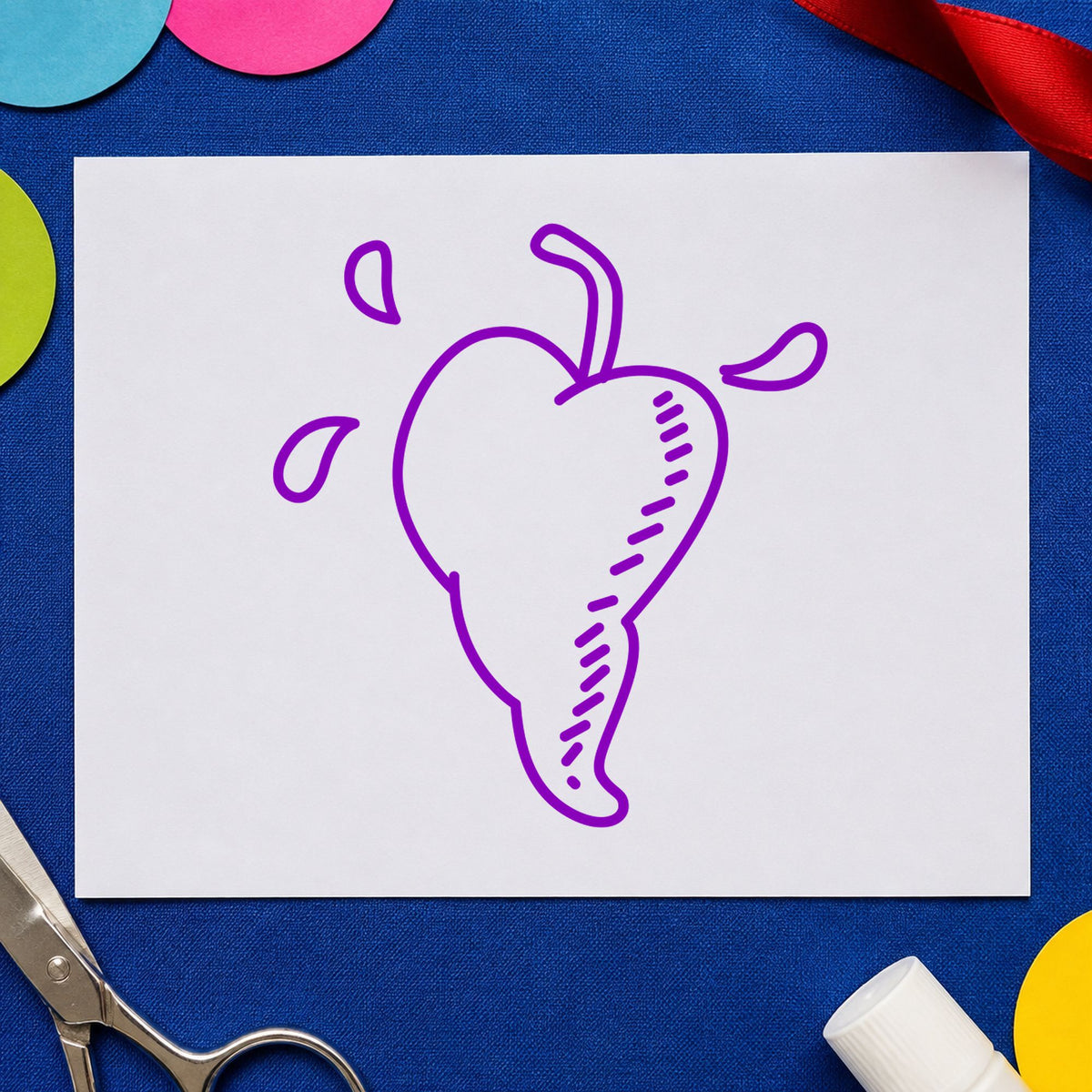 Heart-shaped Pepper Rubber Stamp impression in purple ink on white paper in a styled craft setting.
