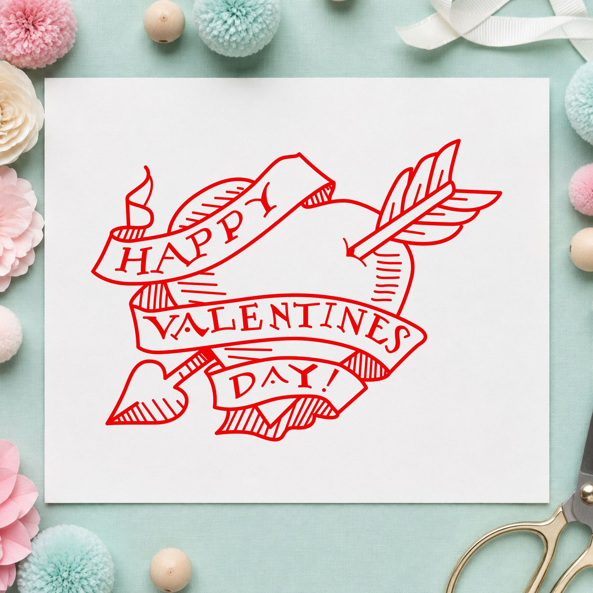 Valentine Heart with Arrow Rubber Stamp impression in red ink on white paper in a styled craft setting.