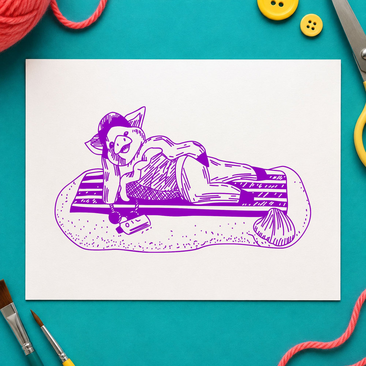 Pig on Beach Blanket Rubber Stamp impression in purple ink on white paper in a styled craft setting.