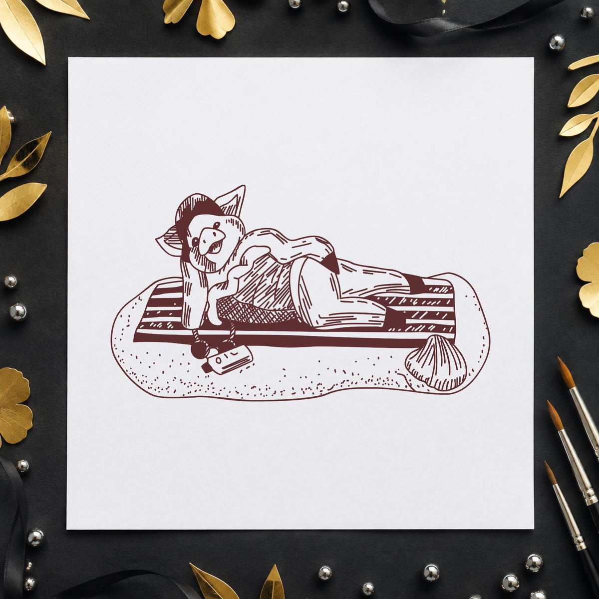 Pig on Beach Blanket Rubber Stamp impression in brown ink on white paper in a styled craft setting.