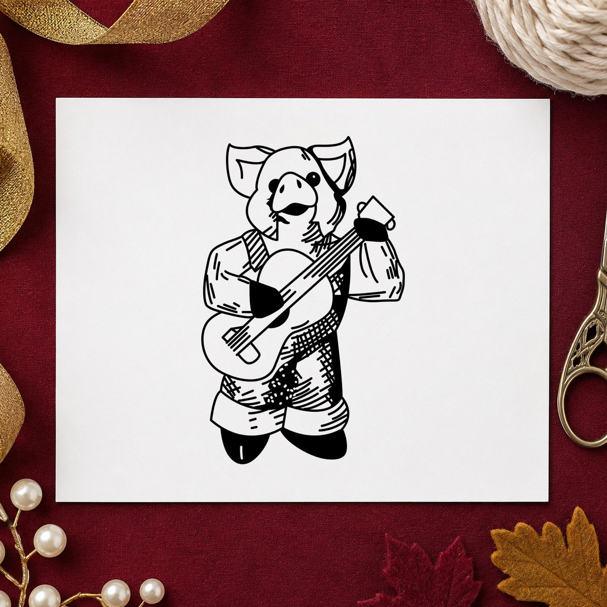 Black impression from a musical instrument stamp, featuring the banjo playing pig design on white paper.