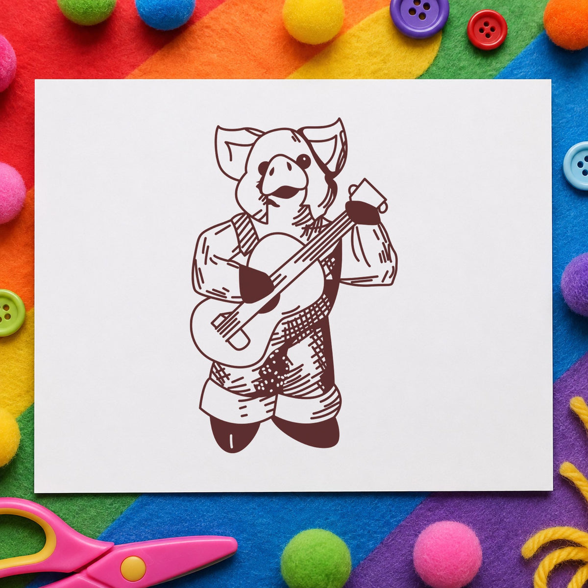 Banjo Playing Pig Rubber Stamp impression in brown ink on white paper in a styled craft setting.
