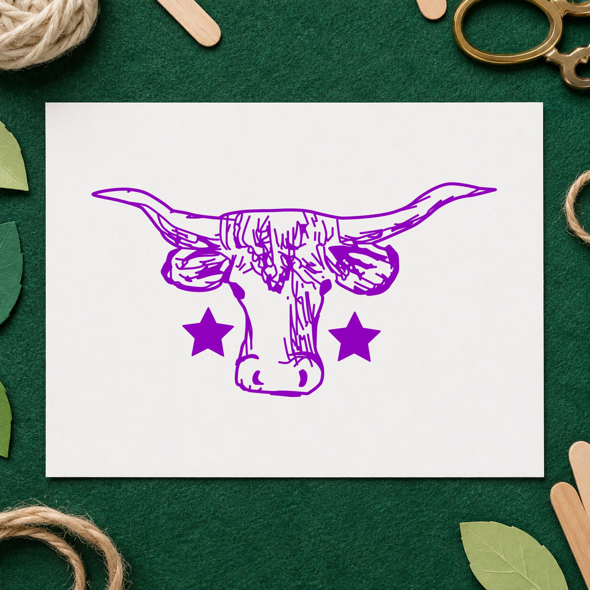 Lone Star Longhorn Bull Rubber Stamp impression in purple ink on white paper in a styled craft setting.
