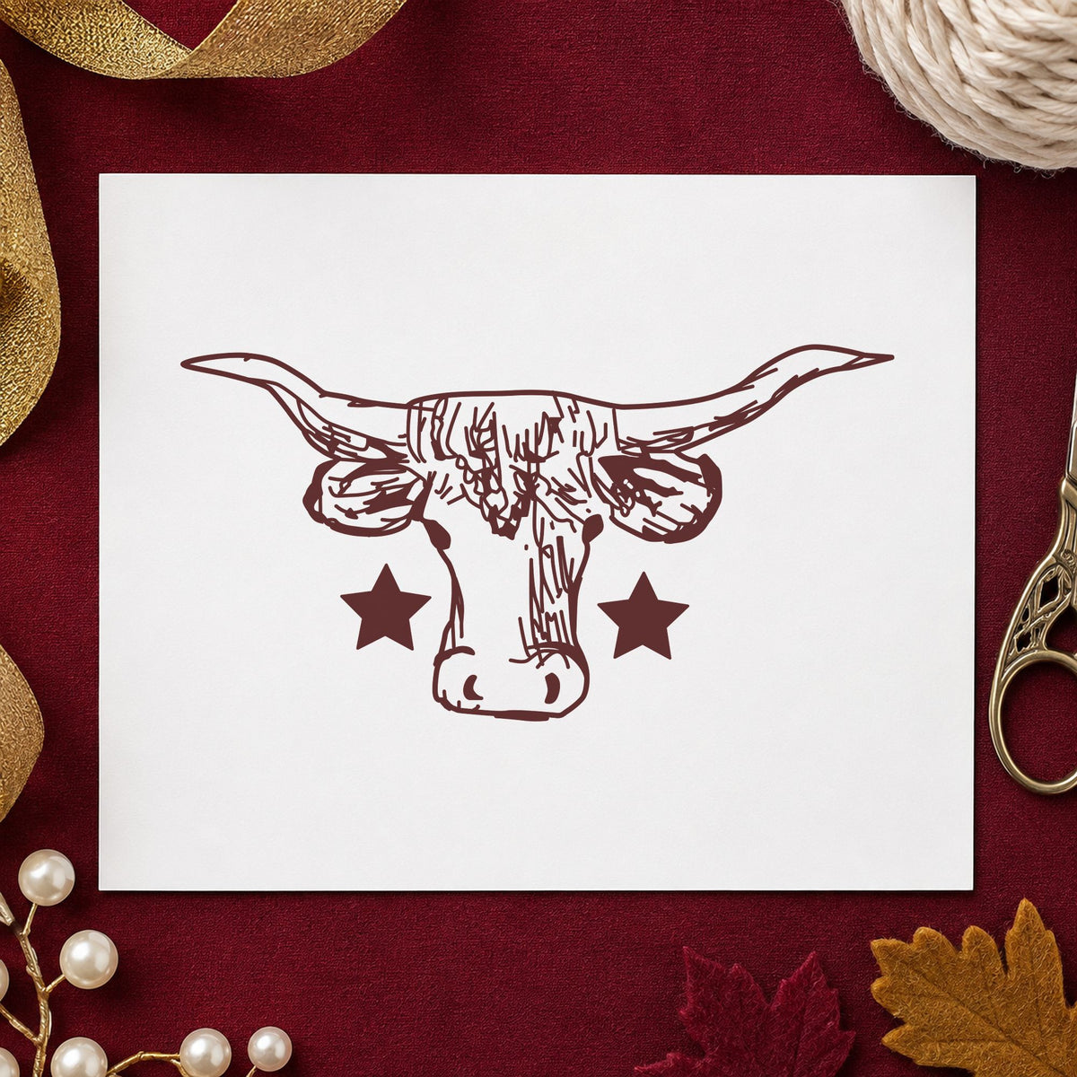 Lone Star Longhorn Bull Rubber Stamp impression in brown ink on white paper in a styled craft setting.