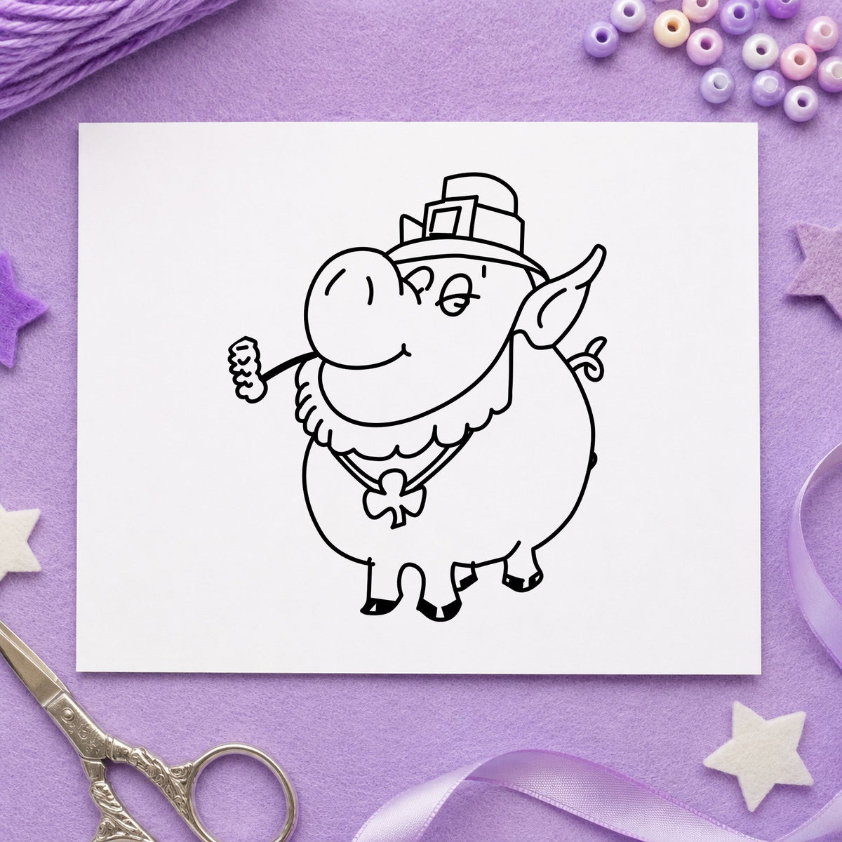 Black impression from a funny pig stamp, featuring the irish pig with shamrock design on white paper.