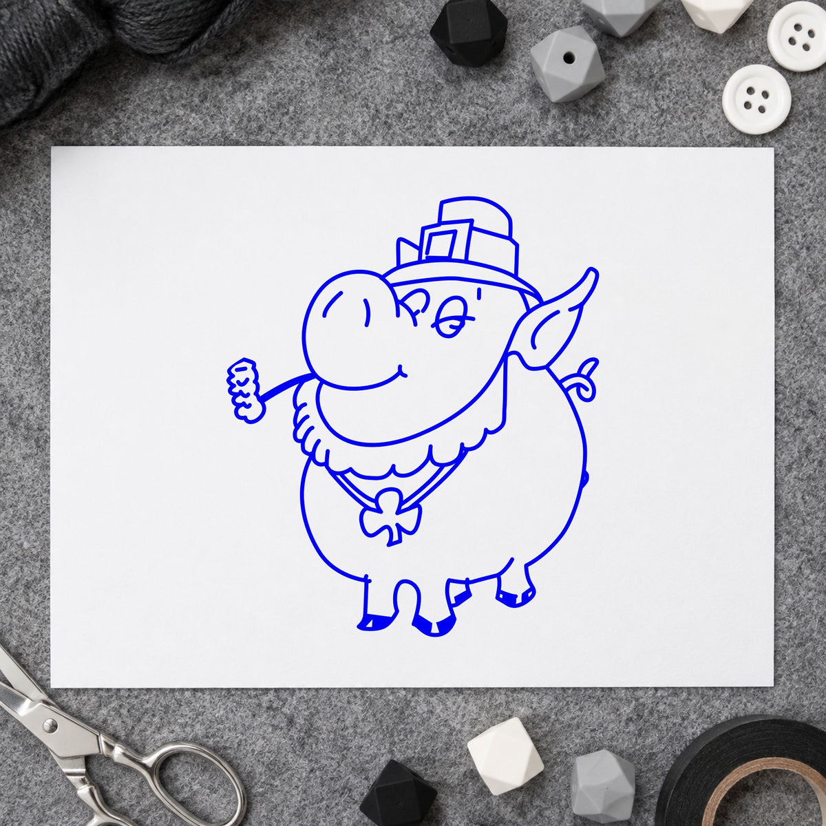 Blue st patrick's day stamp impression featuring the irish pig with shamrock design on white paper.
