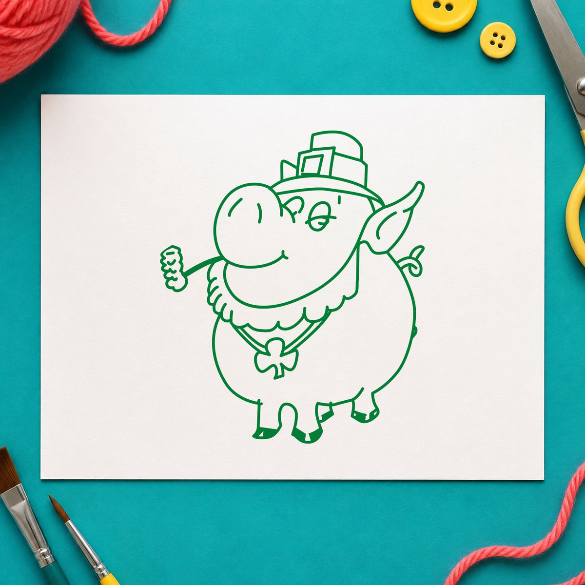 Irish Pig with Shamrock Rubber Stamp impression in green ink on white paper in a styled craft setting.
